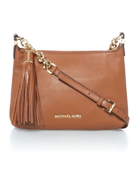 michael kors crossbody tan bag.